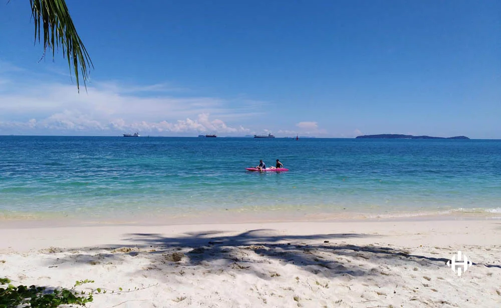 Two men canoeing at Panwa beach