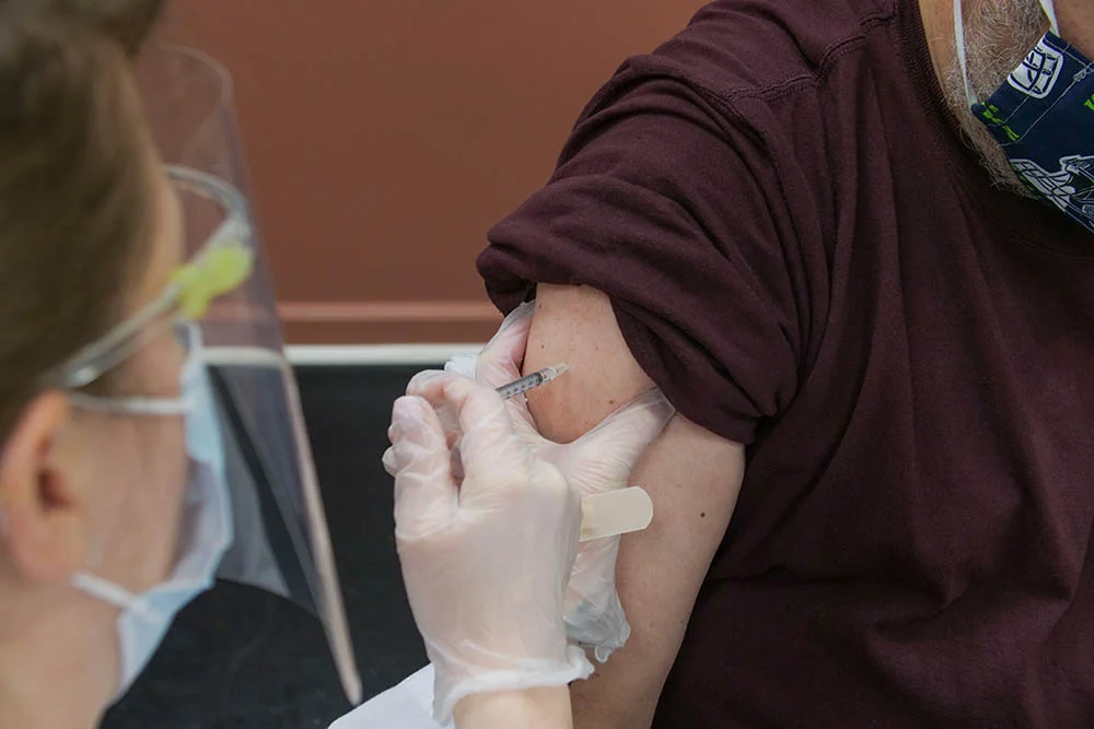 A patient receiving an injection