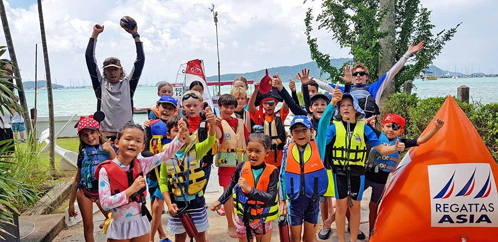 kids in a group photo at a regatta