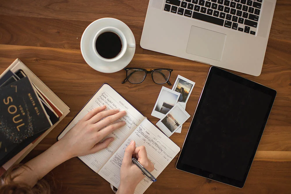 Woman writing in a notebook